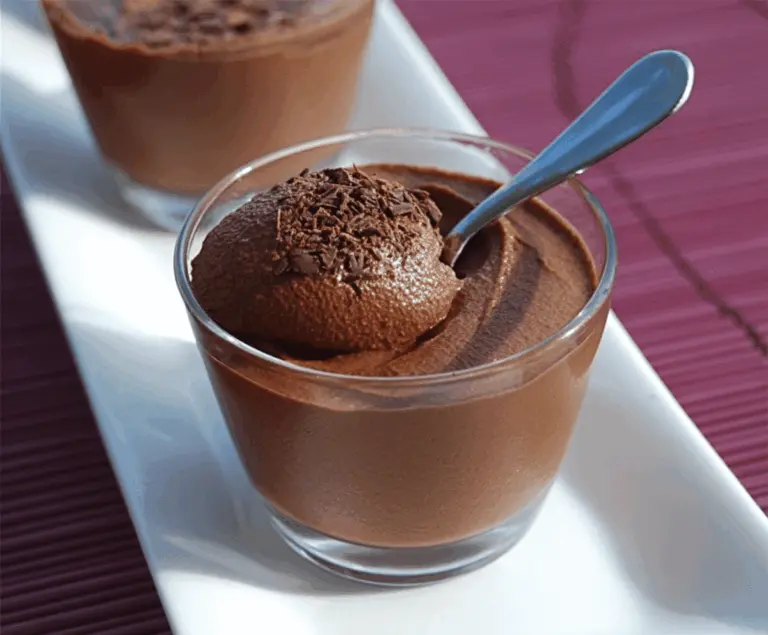 Creamy Gordon Ramsay chocolate mousse garnished with fresh berries and mint, served in a glass bowl, perfect for a decadent dessert.