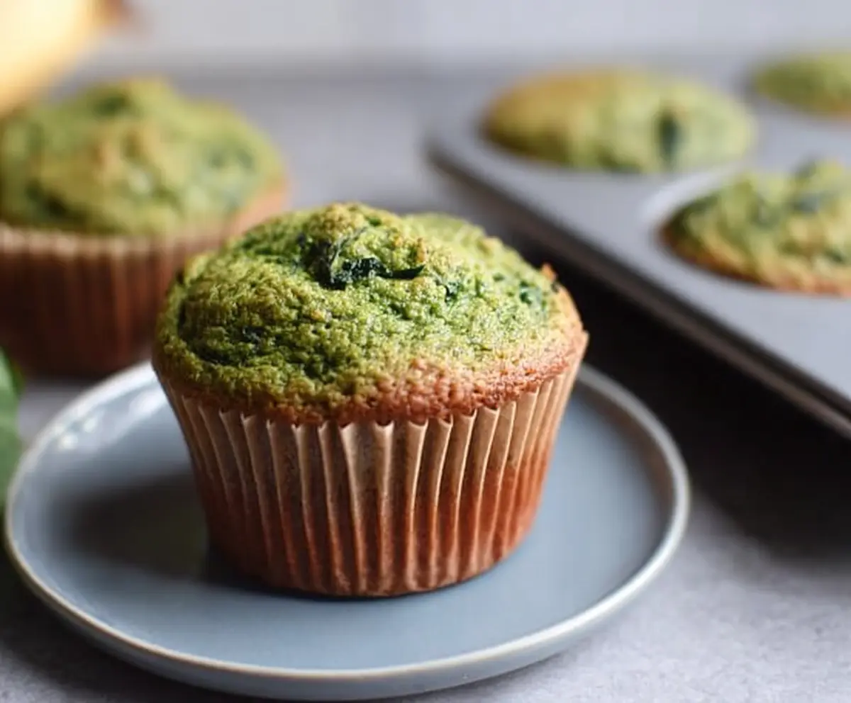 Healthy spinach and banana muffin baked to perfection, ideal for a nutritious breakfast or snack.