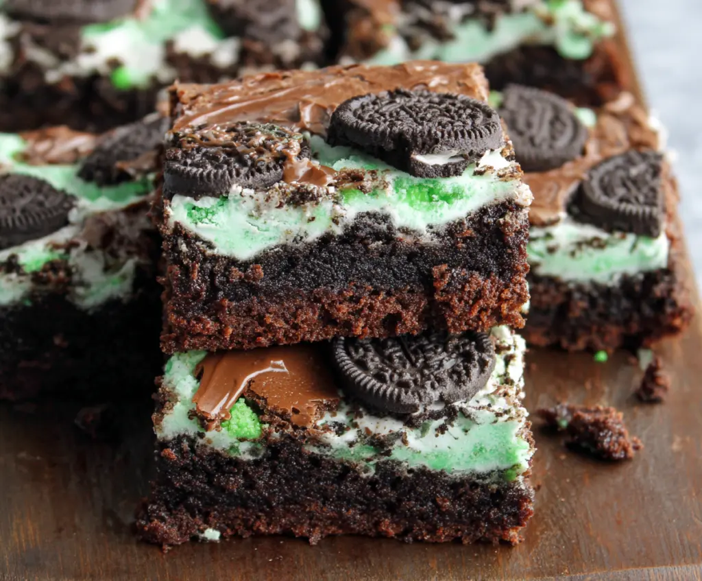 Delicious triple layer fudgy mint Oreo brownies with a rich chocolate and mint topping.