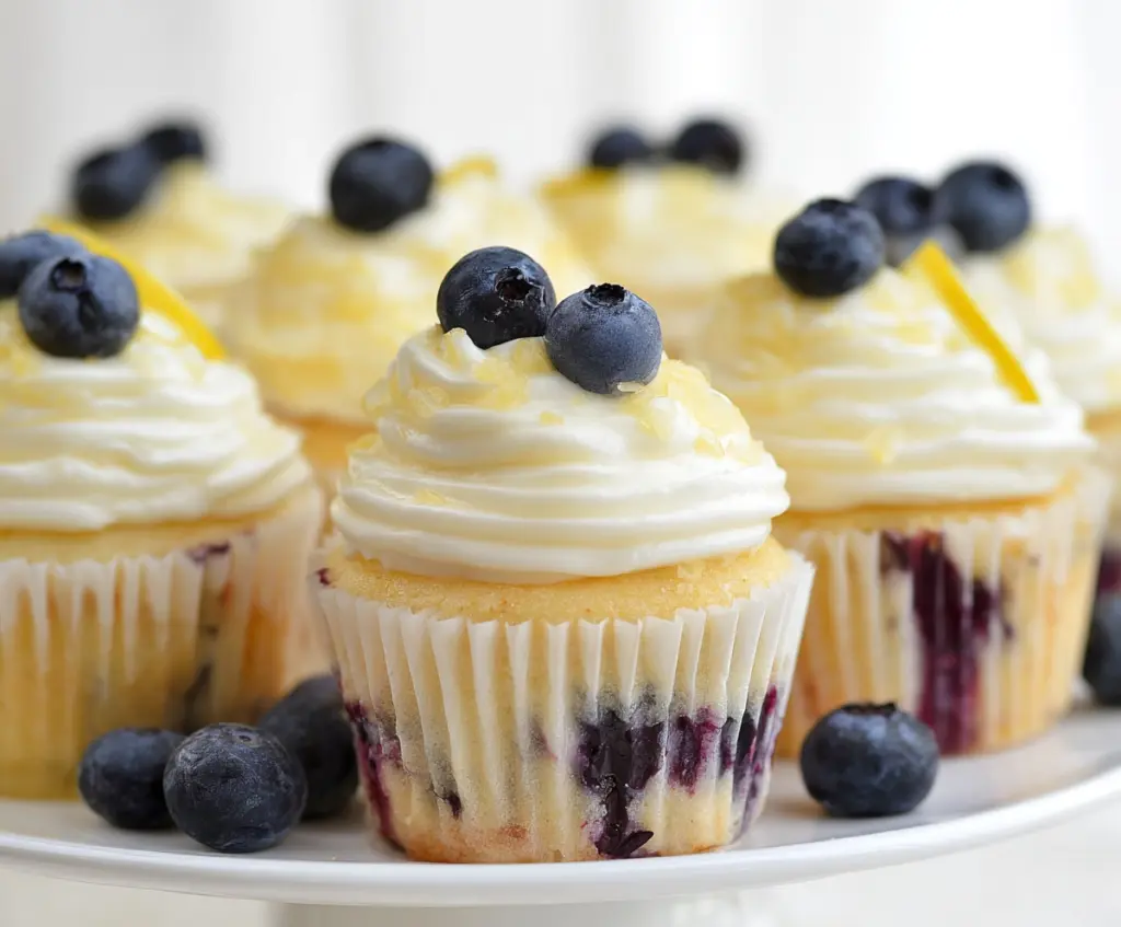 Delicious lemon blueberry cupcakes with fresh blueberries and zesty lemon frosting.
