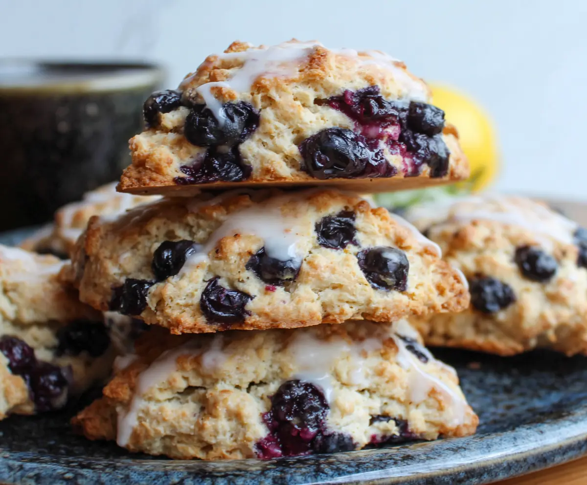 Delicious lemon blueberry sourdough discard scones with fresh blueberries and a zesty lemon glaze.